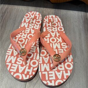 Michael Kors Signature Logo Flip Flops in Coral 🪸